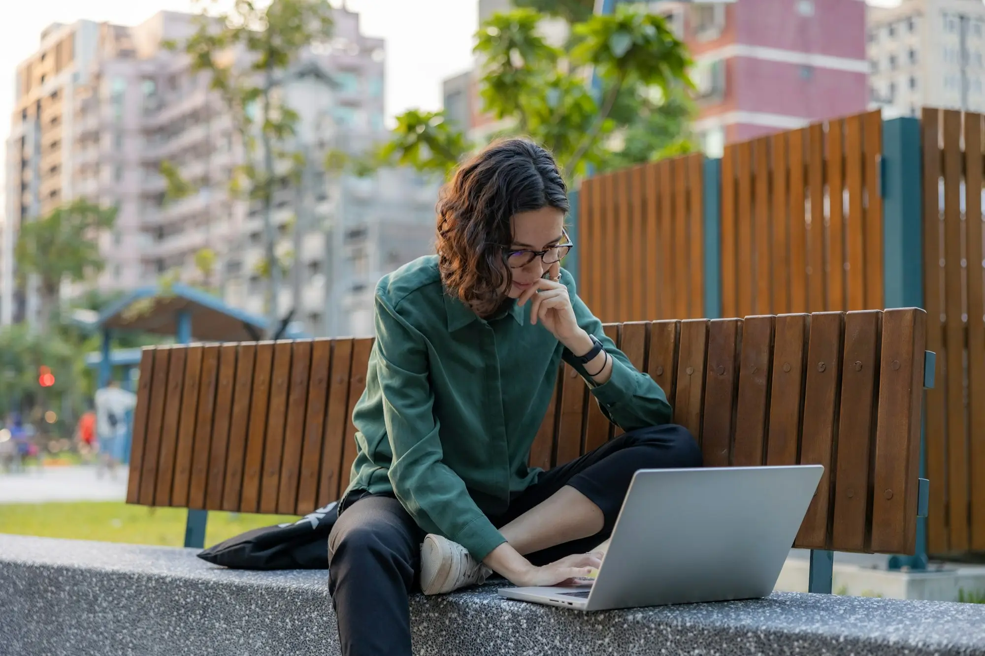 Business owner working on a laptop outdoors